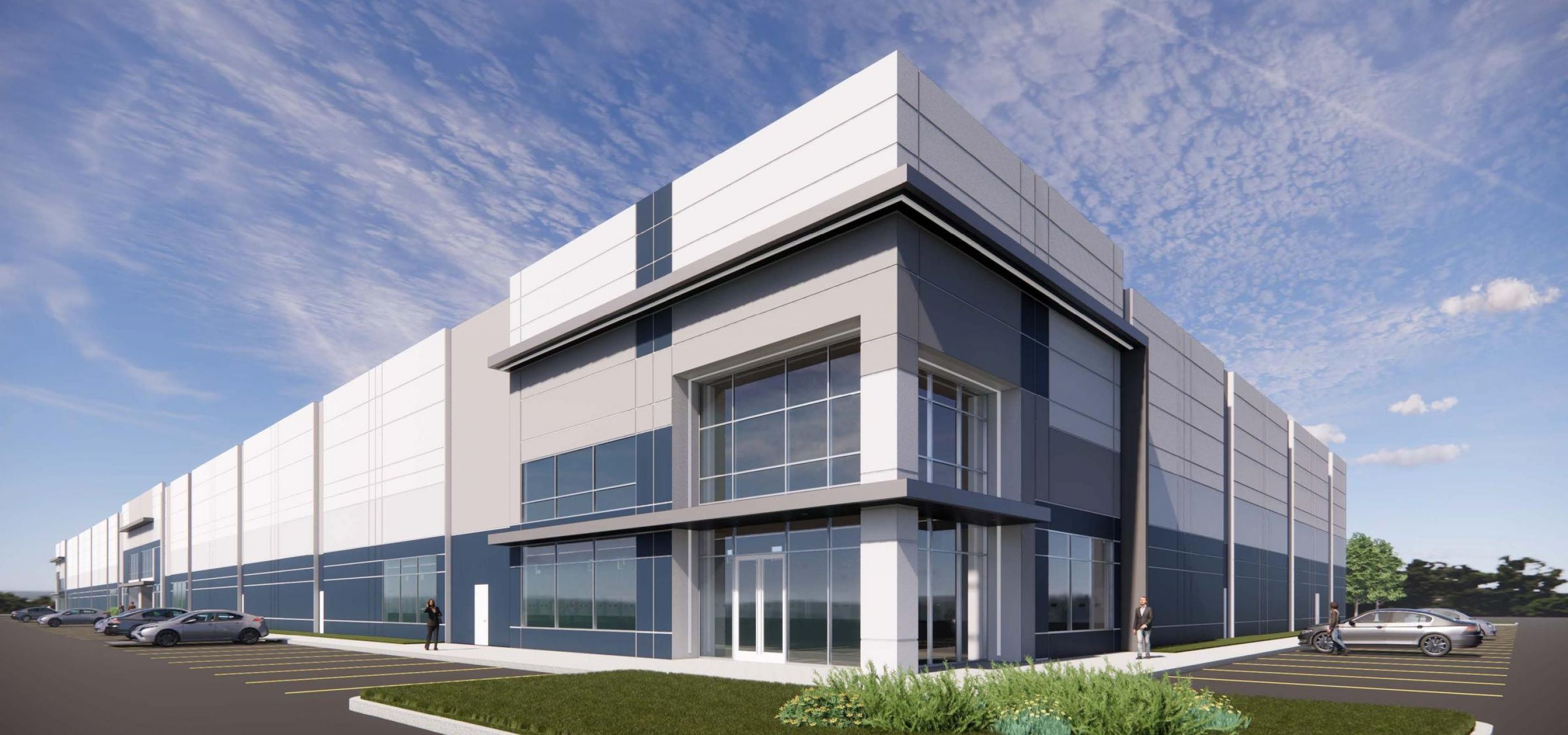 Modern industrial warehouse with large windows, blue and white exterior, cars parked outside, people walking.