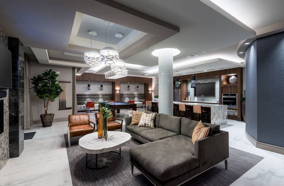 Hanover Company, Hanover Alewife Luxurious modern living room with sectional sofa, dining area, bar, and pool table under elegant lighting.